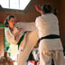 Sempai Sue blocks daughter Anna's kick at Nidan Grading